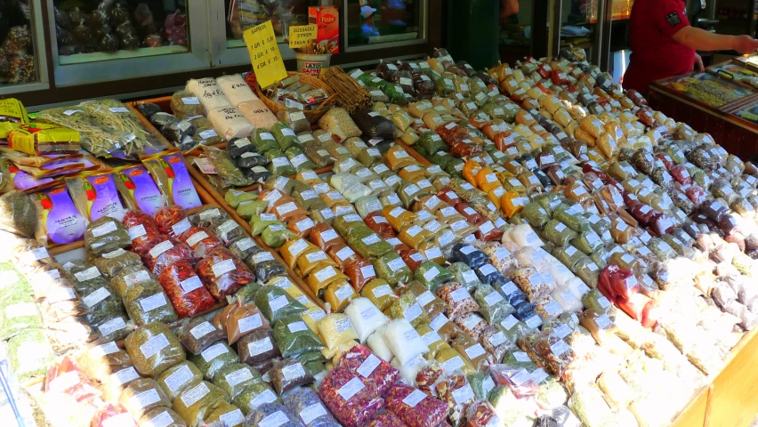 a large display with lots of food and people behind it