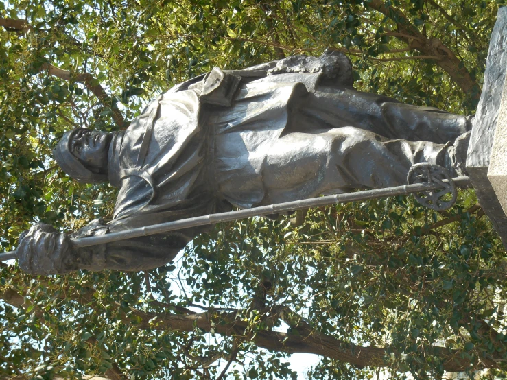 a statue in the form of a sleeping man with a cross