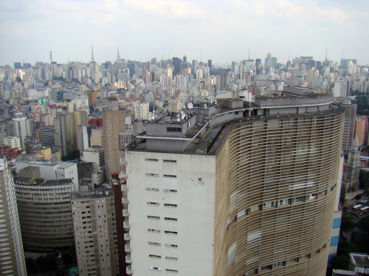 the city skyline is shown from the top of an old building