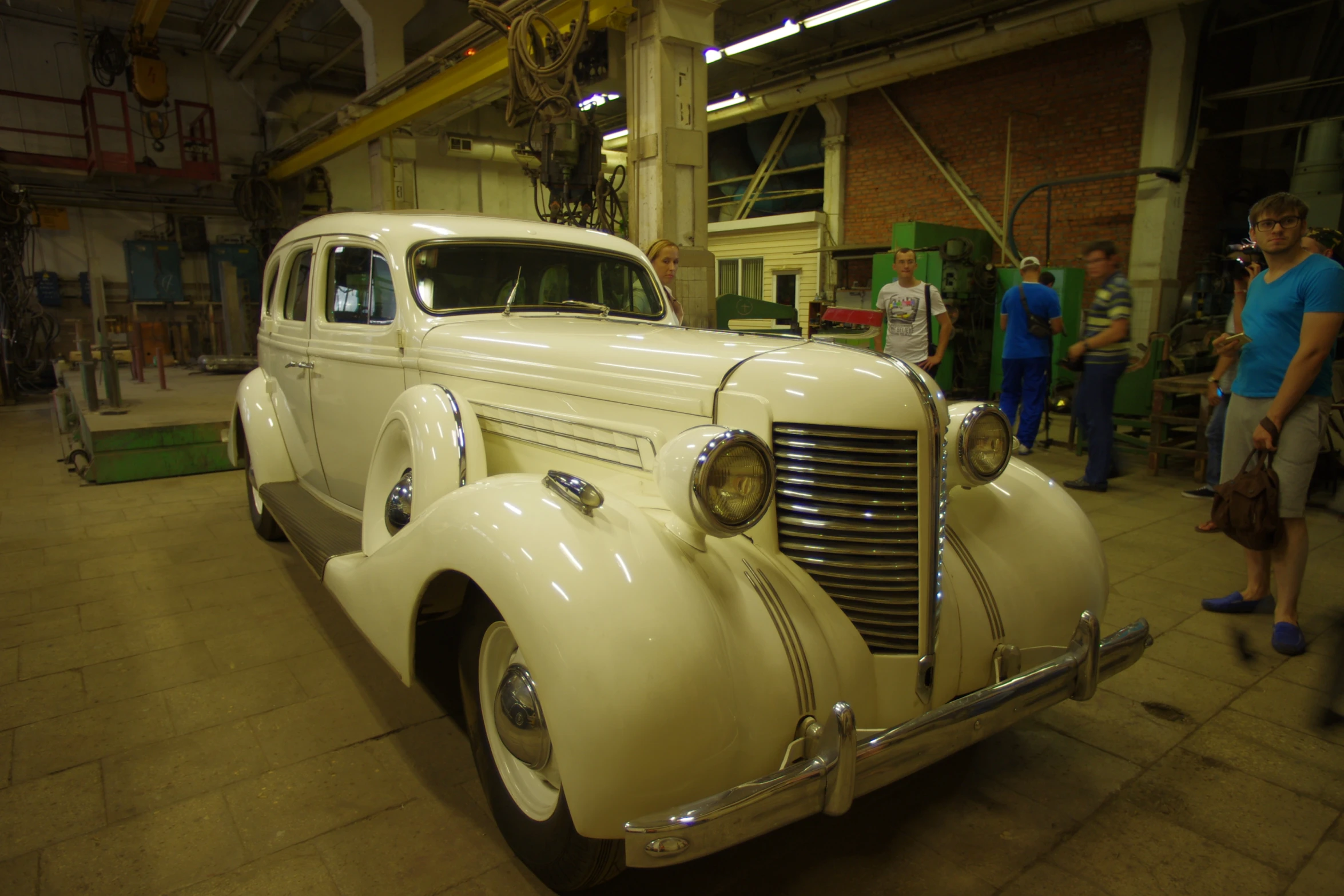 a car being worked on in a building