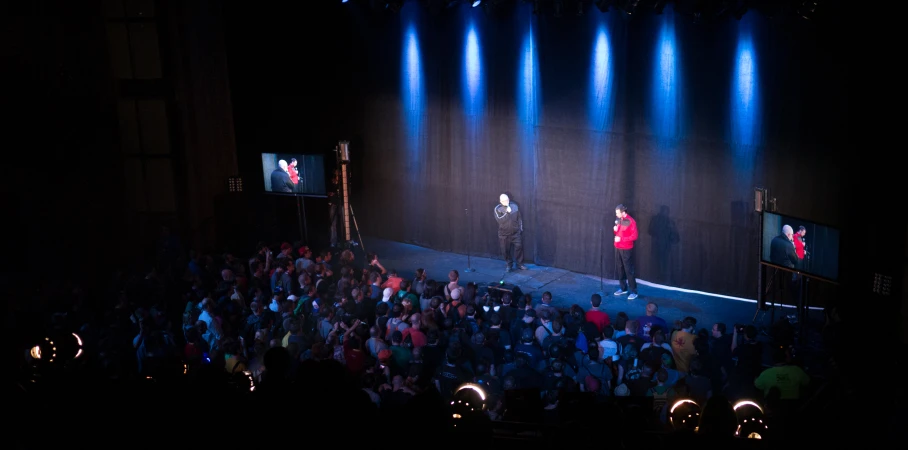 a man and woman on stage as seen from above