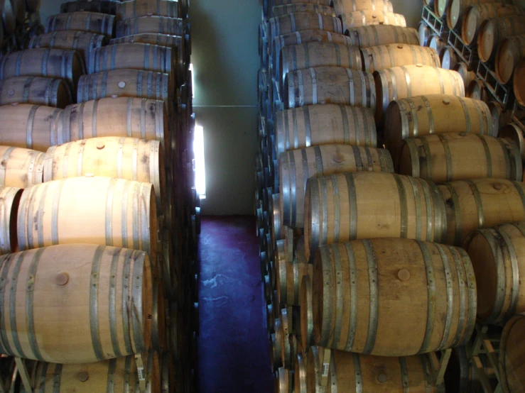 many barrels are stacked high and big on top of each other