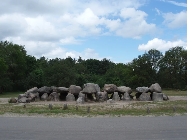 large boulders are shown next to each other near the road