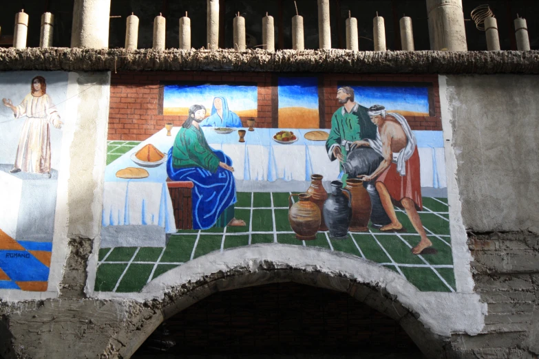 a painting on the side of a wall that depicts some scenes of a biblical scene