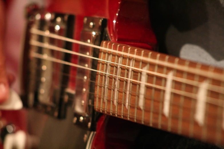 a guitar being played with blurry strings