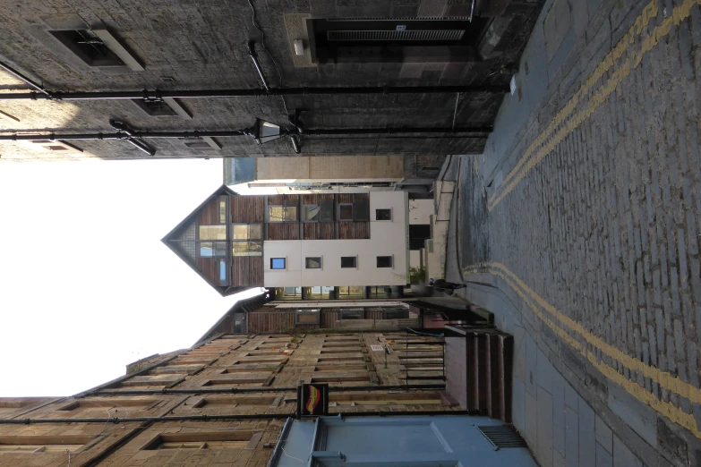 an empty street between two large buildings