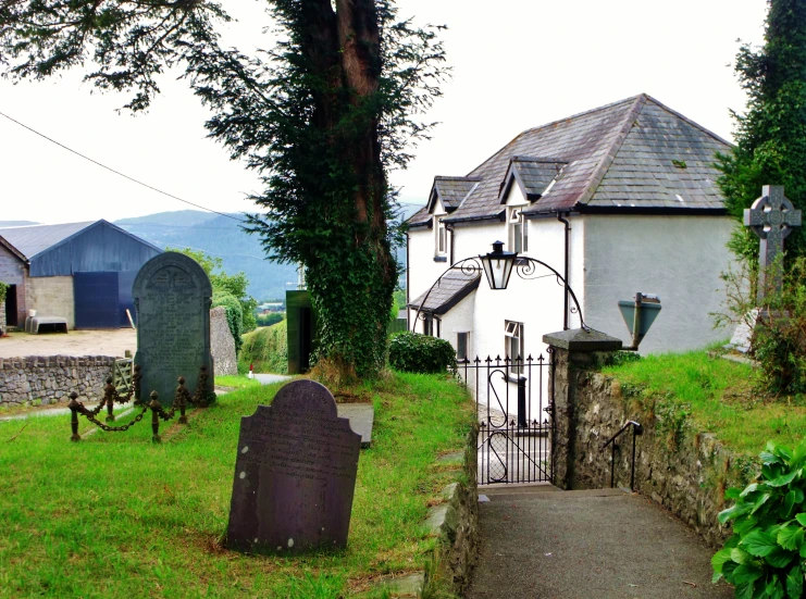 a view of a cemetery with graves next to it