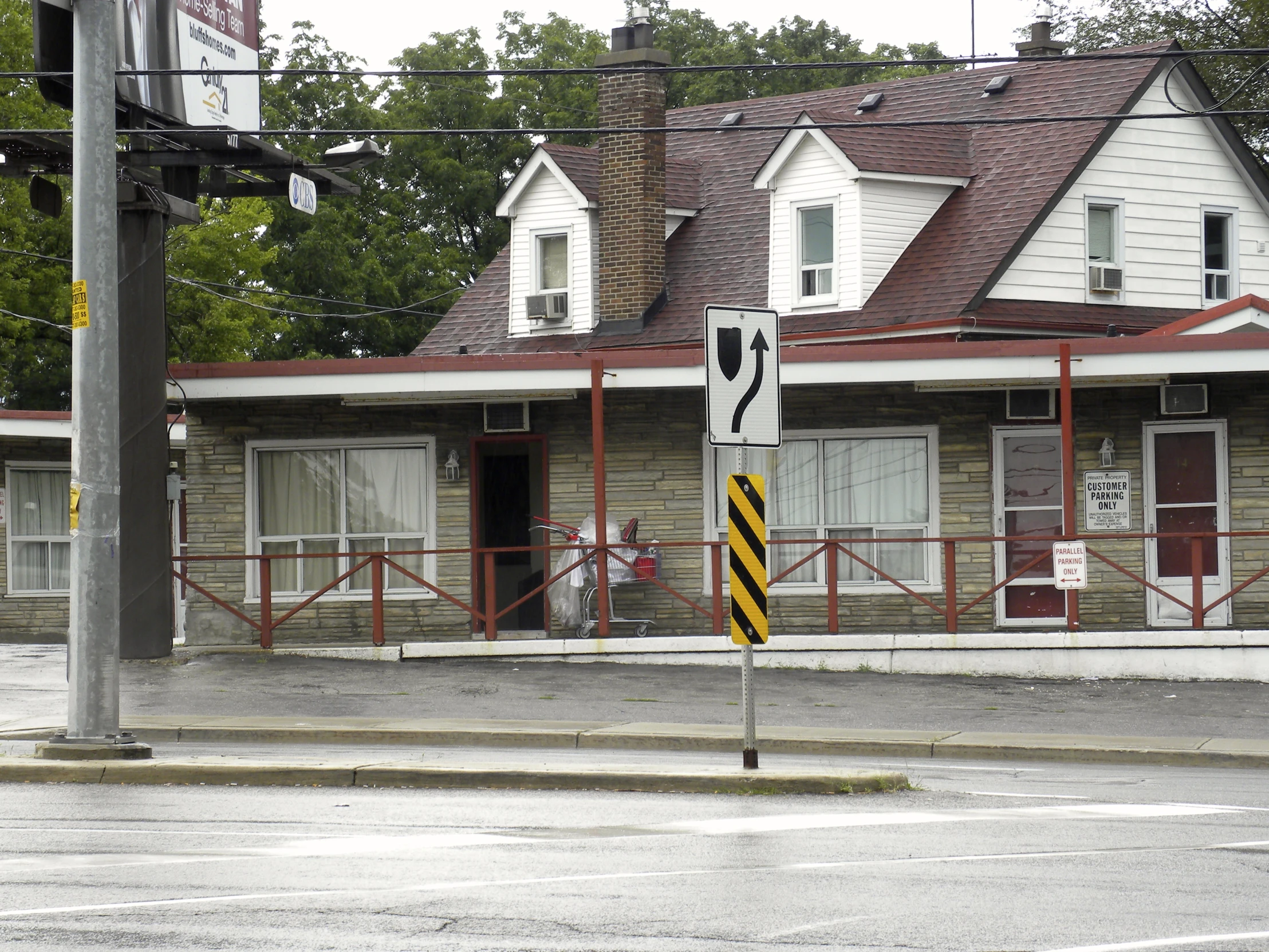 a train crossing sign and a railroad crossing sign on the street