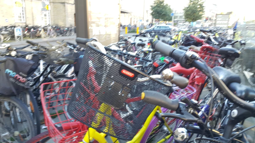 a row of bicycle parked on the side of a road