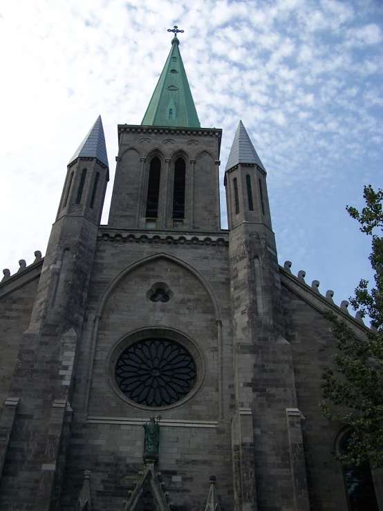 the tower and the large window on the church