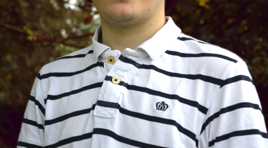 a closeup of the polo shirt collar of a man