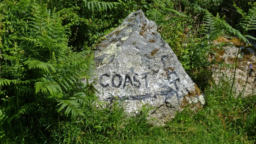 a very large rock with some writing on it