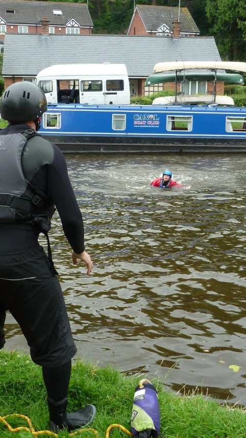 a man on a pair of sandals watches soing in the water