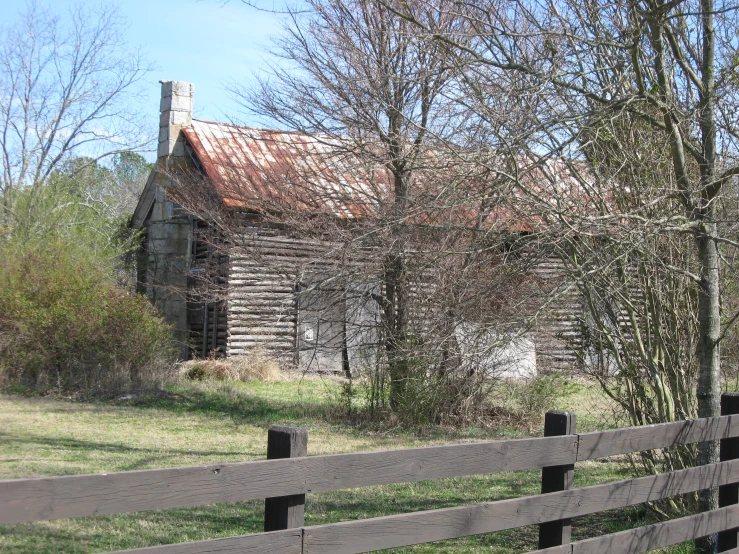 the old building is located close to the tree line