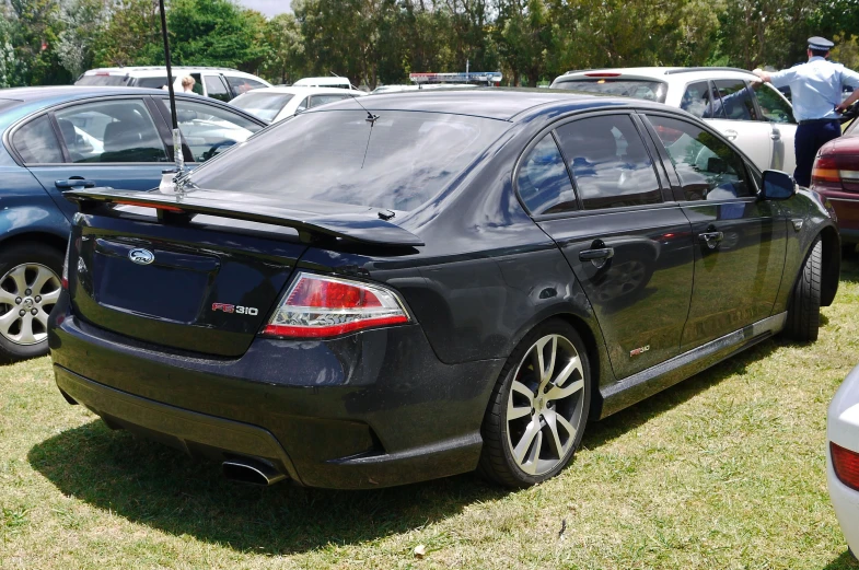 a close up of a car parked next to another car