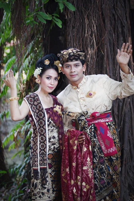 a couple dressed in costume posing for a po