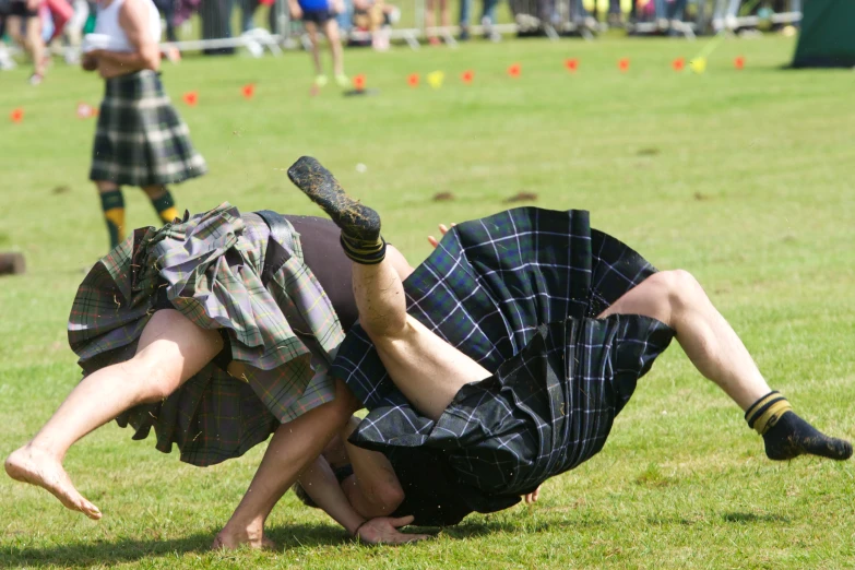 a man falling upside down in a park