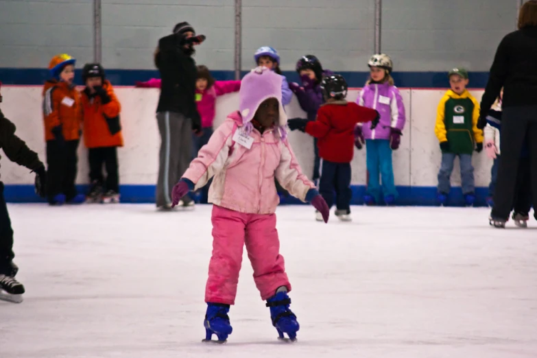 a group of s skating on the ice