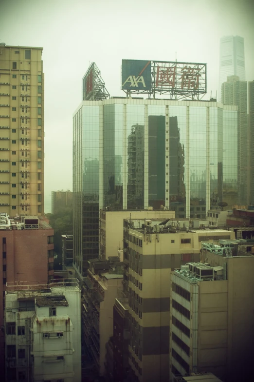 large glass building next to various tall skyscrs