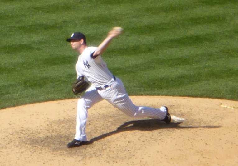 a baseball player throwing the ball to someone