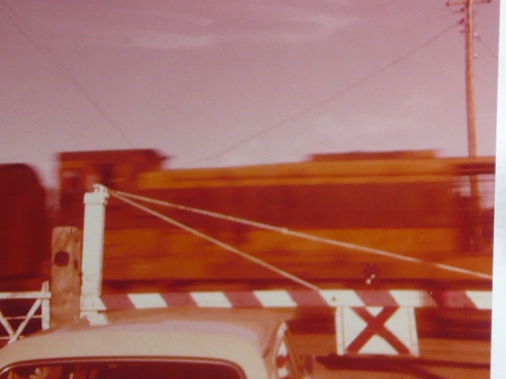 a white truck and train tracks and wires