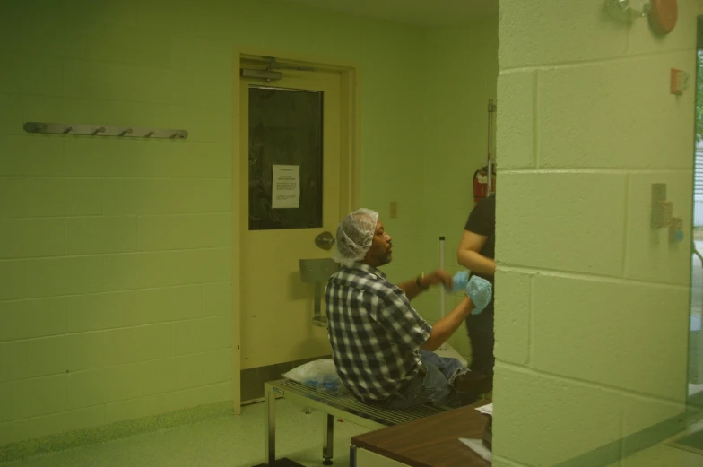 a man getting dressed with a protective mask