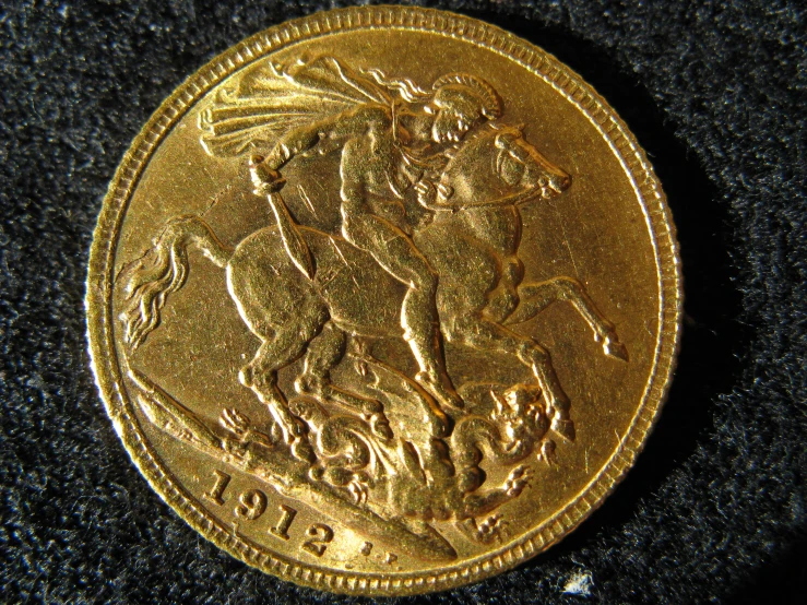 an uncived gold coin with the image of an angel