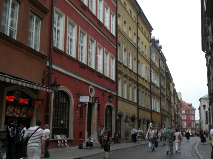 people are walking in an urban street, in this picture