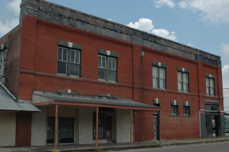 an old building sits on a quiet street