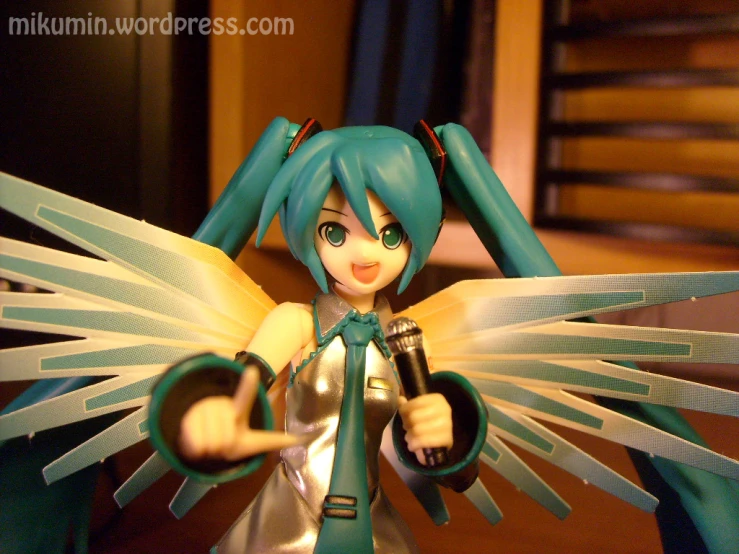an anime figurine holding a microphone in her hands