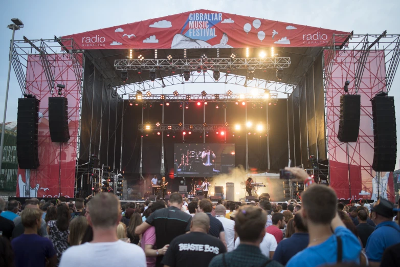 a concert is being performed on stage for a group of people