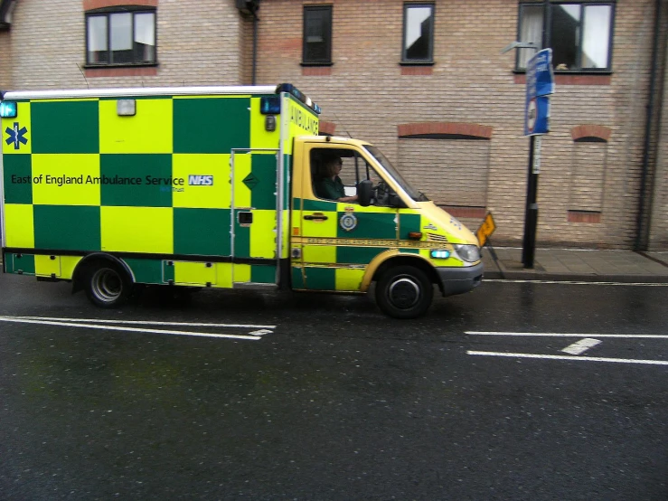 an emergency truck is stopped by a building