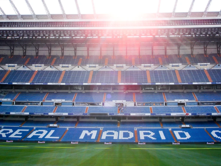 a stadium with many empty seats facing the camera