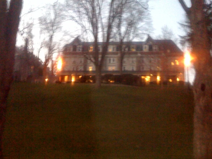 an evening scene of a house at twilight