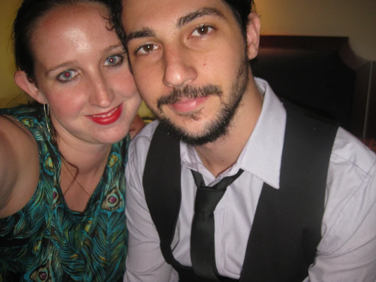 the young man and woman are posing for a po together