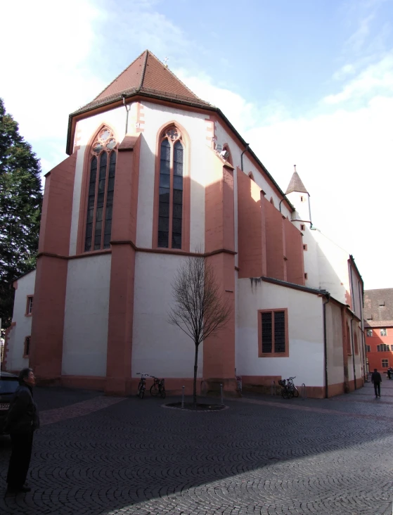 a large church sitting in the middle of a street