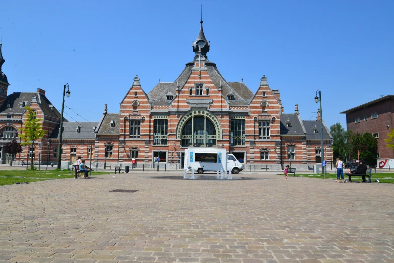 people standing in front of a large building