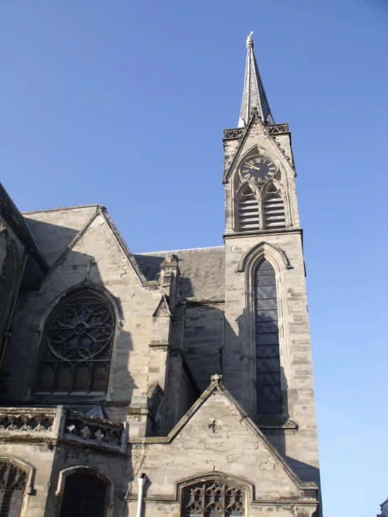 an old, very large cathedral against a bright blue sky