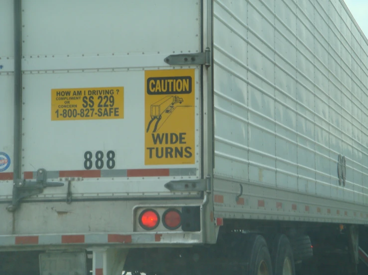 a side view of a truck with an odd sign