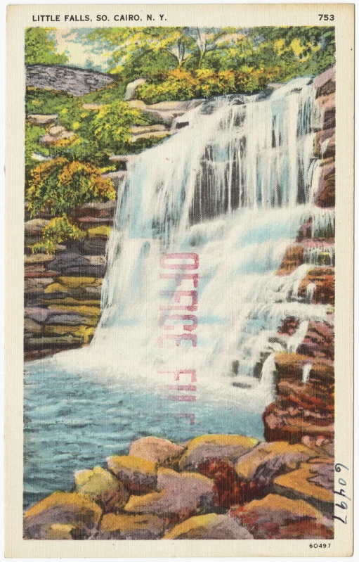 a po of a large waterfall and a man standing near it