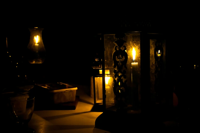 a couple of light fixtures sit on a table