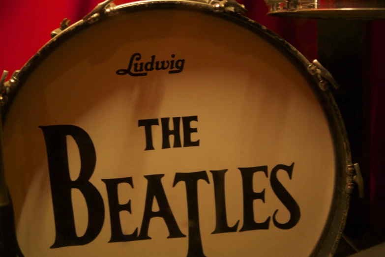 a drum has a sign on it that says the beatles