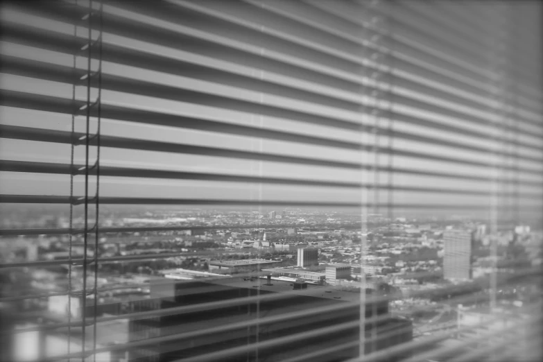 the view from inside a building of city and buildings