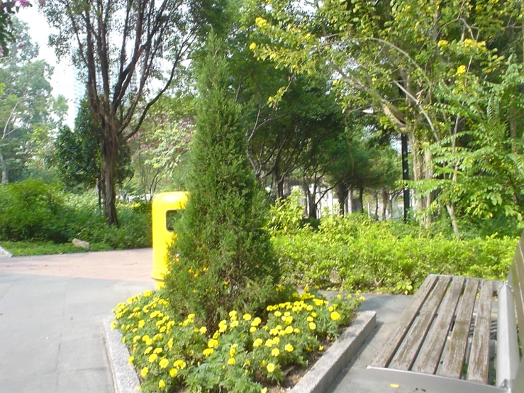 a park with benches and a flower bed