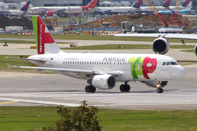 a large white airplane is on a runway