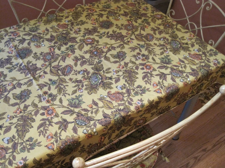 the floral print blanket on top of the chair is very pretty