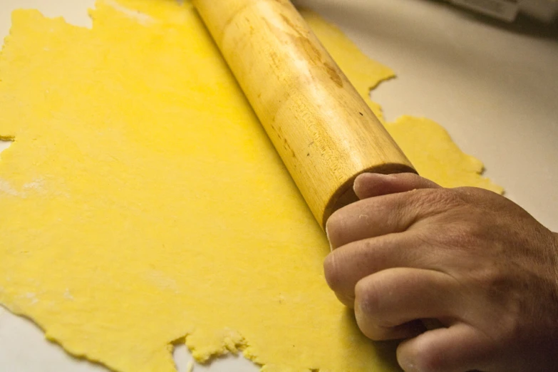 a person with a rolling dough board on it