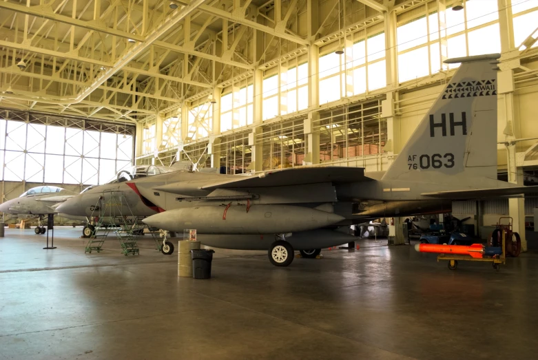 an airplane museum with two military jets sitting in the hangar