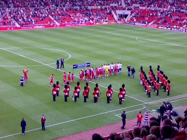 a professional team that is performing on a soccer field