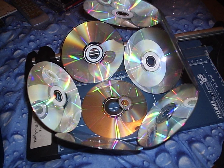 multiple cds are scattered on top of a computer case